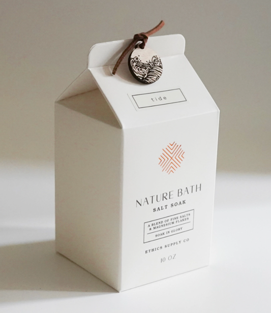Nature Bath salt soap packaging with a decorative tag on a neutral background