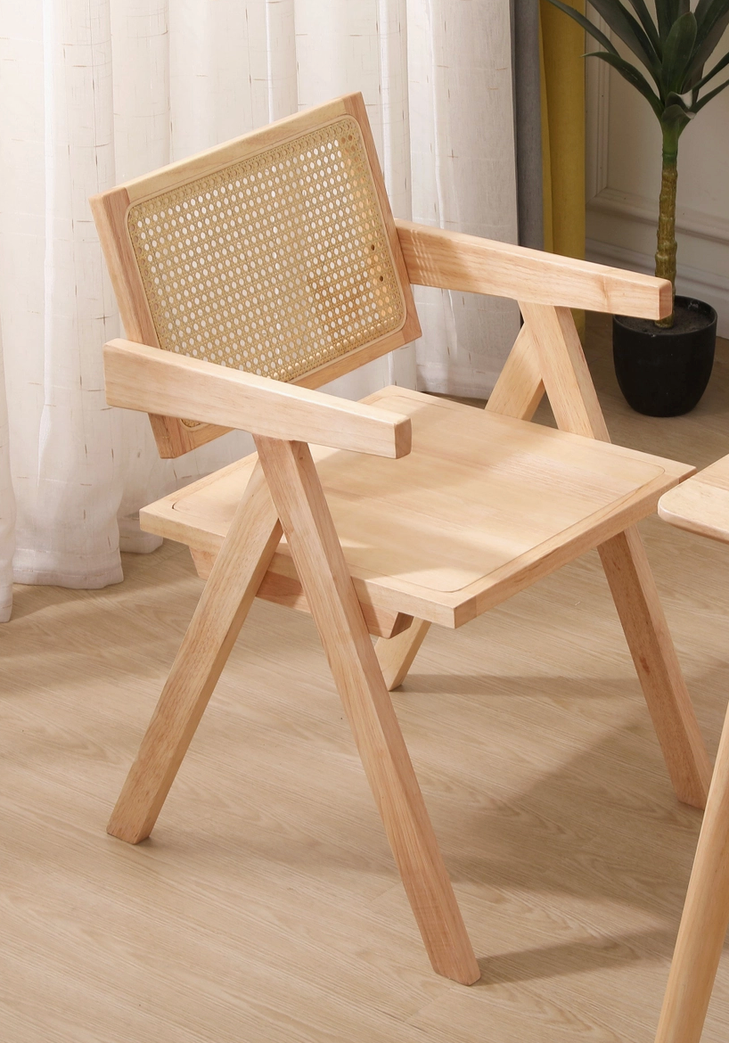 Wooden chair with wicker backrest on a wooden floor