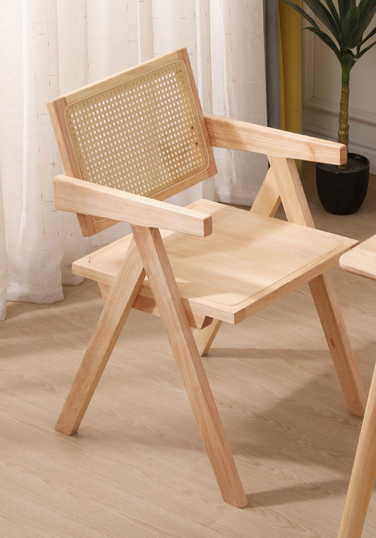 Wooden chair with wicker backrest on a wooden floor